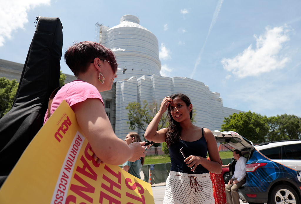 Violet Vonder Haar and Najeebah Hussein talk at a protest at the Capitol
